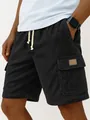 Close-up detail of men's black corduroy cargo shorts featuring drawstring and side pocket. - S / Bottoms / Black