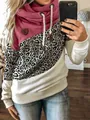 Detailed view of women's cowl neck hoodie featuring leopard print color-block panels - S / Tops / Leopard & Rose Red
