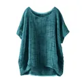Close-up of women's casual loose linen top in teal featuring chest pocket detail - Sky Blue
