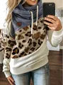 Detail view showing the leopard print and cowl neck of this stylish color-blocked hoodie - 3XL / Tops / Apricot Leopard + Blue