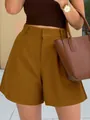 Detail of stylish women high waist wide leg A-line shorts in brown with button closure. - Brown