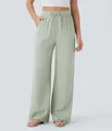 High-waisted sage green linen wide-leg pants with drawstring and side pockets. - Light Green