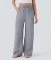 Macro view of grey high-waisted linen wide-leg pants with drawstring on a model. - S / Bottoms / Gray