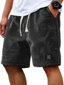 Macro view of men's waffle knit casual shorts highlighting the breathable fabric texture. - M / Bottoms / Black