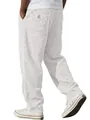 Detail view of men's white corduroy pants showing textured fabric and back pocket label - S / Bottoms / White