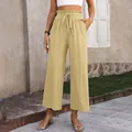 Casual high-waisted wide-leg cotton linen trousers for women in a natural outdoor setting - Khaki