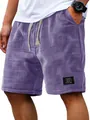 Close-up of men's purple waffle knit shorts showing fabric texture and drawstring - M / Bottoms / Purple