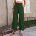 Detailed view of women's high-waisted wide-leg cotton linen trousers in dark green - Army Green