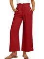 Detail view of red wide-leg trousers featuring an elastic drawstring waist and loose fit - S / Bottoms / Orange Red