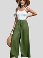Woman wearing olive green high-waisted wide leg cotton linen trousers with drawstring - S / Bottoms / Army Green