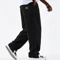 Side view of black vertical striped corduroy loose fit straight casual pants for men - S / Bottoms / Black