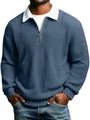 Detail view of men's blue waffle knit polo shirt with white contrast collar and half-zip. - Navy Blue