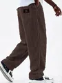 Close-up of vintage brown corduroy pants showing vertical stripe texture - Coffee