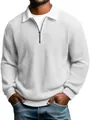 Detail view of a white waffle knit long-sleeve polo shirt for men featuring a zipper collar. - White