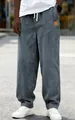 Close-up of men's loose fit grey corduroy trousers with drawstring and soft fabric texture - S / Bottoms / Navy Blue