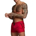 Side view of red quick-dry swim trunks featuring a secure zipper pocket and drawstring. - M / Bottoms / Red