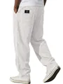 Detail of white corduroy straight leg pants for men with black embroidered label on back pocket. - S / Bottoms / White