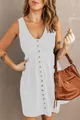 Close-up of a white sleeveless button-down dress with a V-neck and elastic waist. - S / Bottoms / White