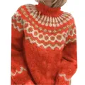 Close-up of orange chunky knit sweater with Fair Isle jacquard pattern on high neck. - S / Tops / Red