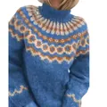Detailed macro view showing the thick Nordic jacquard knit pattern on a blue high neck sweater - S / Tops / Blue