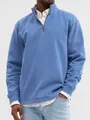 Detail shot of men's blue quarter-zip stand collar sweatshirt with layered white shirt - Sky Blue