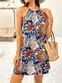 Close-up detail of a bohemian printed halter mini dress styled with a straw beach tote bag. - S / Top And Bottom / Dark Blue