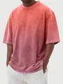Close-up of men's oversized washed gradient short sleeve T-shirt with acid wash texture - Watermelon red