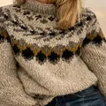 Detail showing the intricate Fair Isle jacquard knit pattern on a warm high-neck sweater - S / Tops / Apricot Leaf Pattern