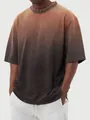 Close-up of men's vintage washed T-shirt with a brown to dark grey gradient finish - Coffee