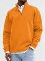 Close-up showing the texture and zipper detail of an orange stand-up collar sweatshirt - M / Tops / Orange Red