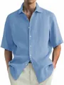 Detail of a light blue washed cotton short sleeve casual shirt for men with texture. - M / Tops / Blue