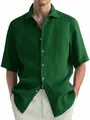 Detail of a men's dark green washed cotton short-sleeve casual shirt - M / Tops / Green