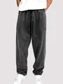 Gros plan du pantalon de jogging délavé pour hommes avec cordon de serrage gris foncé. - S / Bas / Noir
