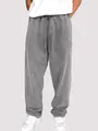 Vue complète du pantalon de jogging gris délavé pour hommes avec cordon de serrage. - S / Bas / Gris