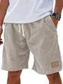 Detail view of men's casual linen-like drawstring shorts with leather patch - S / Bottoms / Khaki