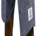 Detailed macro view of the white decorative label on these grey corduroy men's shorts - Purple