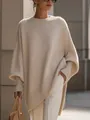 Dettaglio di un maglione in maglia beige da donna con design dell'orlo asimmetrico - XS / Top / Albicocca