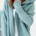 Detailed close-up showing the chunky knit texture of a mint green hooded cardigan - S / Tops / Mint Green