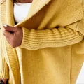 Detailed macro view of yellow chunky knit cardigan fabric texture and ribbed cuffs - S / Tops / Yellow