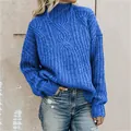 Detailed view of the vibrant blue cable-knit texture on a cozy high-neck sweater - Sapphire Blue