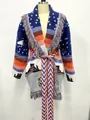 Detailed view of vintage jacquard knit wool cardigan with colorful fringes and waist belt - S / Tops / Blue
