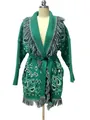Close-up detail view of a green Bohemian paisley knitted cardigan with fringe and belt. - S / Tops / Green