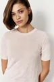 Close-up detail of a light pink short sleeve knit sweater with intricate patterns - S / Tops / Pink