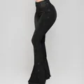 Side view detail of black high-waisted flare jeans with button trim - 3XL / Bottoms / Black
