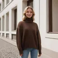Stylish women's brown thick turtleneck knit sweater in loose fit for autumn and winter - Coffee