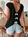 Back view of black V-neck T-shirt featuring three decorative white bows on textured fabric - S / Tops / Black