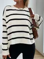 Macro view of classic black and white striped knit texture on oversized crew neck sweater - S / Tops / White