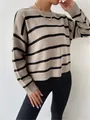 Detailed view of a loose-fitting khaki and black striped knit pullover with round neck - S / Tops / Khaki
