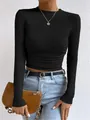 Detail view of a women's black long sleeve waffle knit slim fit T-shirt crop top - S / Tops / Black