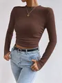 Close-up of brown waffle knit long sleeve top showing slim fit and side ruching details - S / Tops / Brown